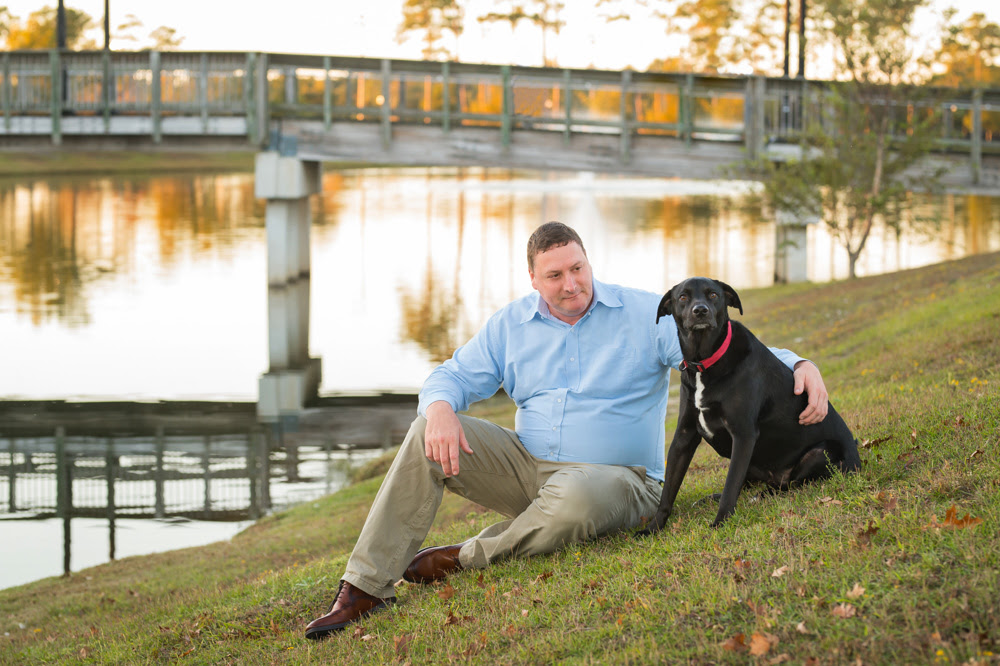 attorney bill luse sitting in the grass with dakota, his dog